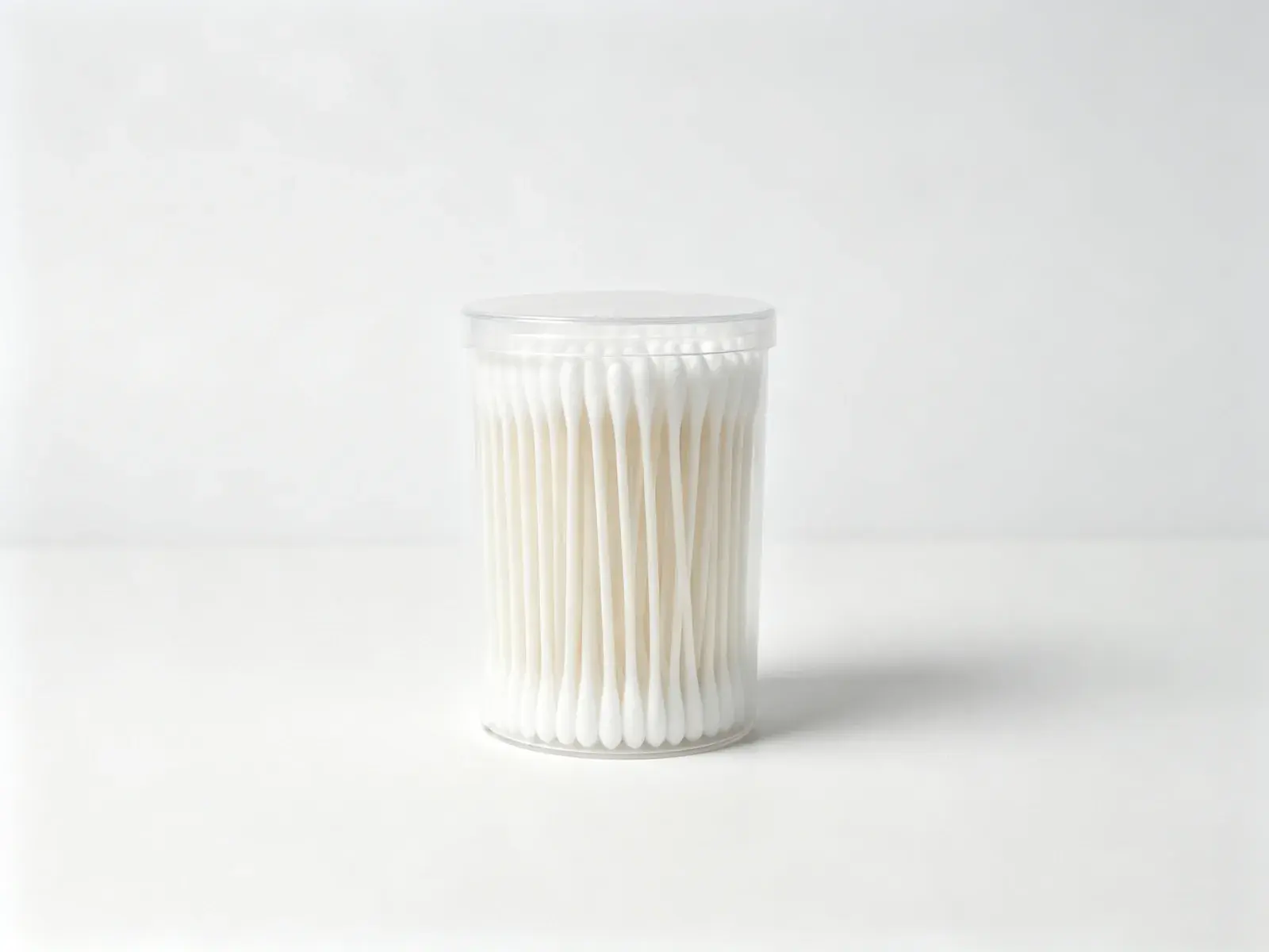 Compact jar of white baby cotton swabs